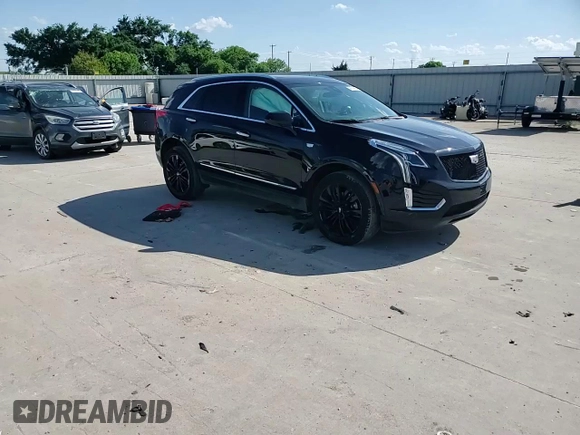 2019 Cadillac XT5 Premium Luxury FWD z VIN 1GYKNERS1KZ284355, wystawiony jako Copart lot #54150405 z przebiegiem 50 001 mil mil oraz Szkody całkowita. Historia ofert i sprzedaży dostępna na DreamBid. Obrazek 14.