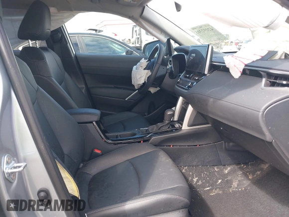 2023 Toyota Corolla Cross XLE with VIN 7MUEAABG8PV077117, listed as a IAAI auction lot 42052305 with 21,571 mi miles and . Bid and sale history available at DreamBid. Image 5.