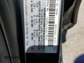 2012 Mazda 3 i Touring with VIN JM1BL1V77C1700351, listed as a Copart auction lot 59268645 with Not provided miles and Salvage title. Bid and sale history available at DreamBid. Image 12.