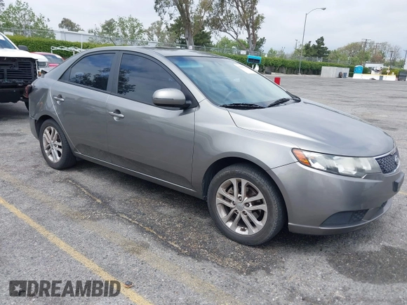 2012 Kia Forte EX with VIN KNAFU4A2XC5560585, listed as a IAAI auction lot 42121133 with 151,079 mi miles. Bid and sale history available at carsss.com. Image 1.