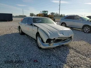 1995 Jaguar XJ with VIN SAJKX1745SC739290, listed as a Copart auction lot 82887524 with Not provided miles and Salvage title. Bid and sale history available at DreamBid. Image 10.