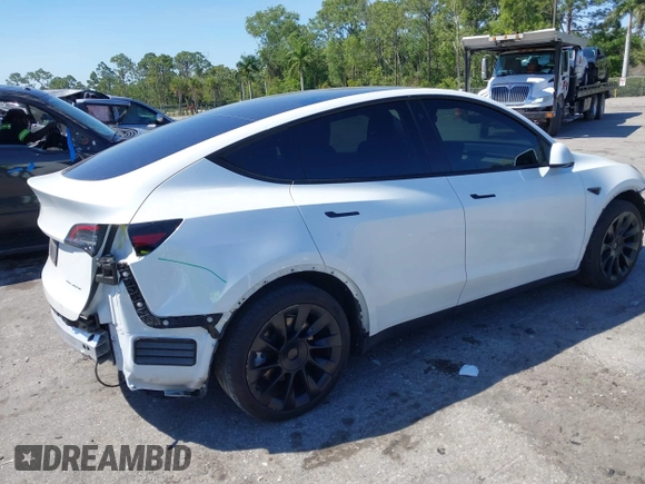 2022 Tesla Model Y Long Range with VIN 7SAYGAEE8NF431786, listed as a IAAI auction lot 41750353 with 67,846 mi miles and . Bid and sale history available at carsss.com. Image 4.