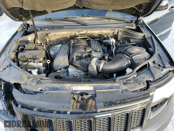 2012 Jeep Grand Cherokee SRT8 with VIN 1C4RJFDJ2CC329621, listed as a Copart auction lot 86772154 with 236,800 mi miles and Salvage Title. Bid and sale history available at carsss.com. Image 12.