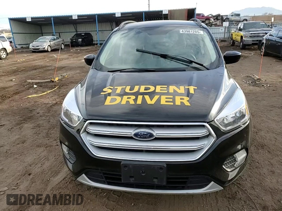 2018 Ford Escape SE z VIN 1FMCU9GDXJUD21466, wystawiony jako Copart lot #46266395 z przebiegiem Nie podano mil oraz Szkoda całkowita • Salvage title. Historia ofert i sprzedaży dostępna na DreamBid. Obrazek 11.