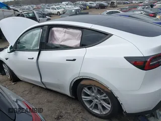 2023 Tesla Model Y Long Range with VIN 7SAYGDEE2PA145398, listed as a IAAI auction lot 41546573 with 20,812 mi miles and . Bid and sale history available at carsss.com. Image 13.