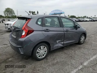 2015 Honda Fit LX z VIN 3HGGK5H58FM785137, wystawiony jako Copart lot #59013315 z przebiegiem 84 592 mil mil oraz Szkoda całkowita • Salvage title. Historia ofert i sprzedaży dostępna na DreamBid. Obrazek 3.