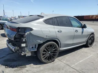 2022 BMW X6 xDrive40i z VIN 5UXCY6C01N9M95573, wystawiony jako Copart lot #54049805 z przebiegiem 24 031 mil mil oraz Szkoda całkowita • Salvage title. Historia ofert i sprzedaży dostępna na DreamBid. Obrazek 3.