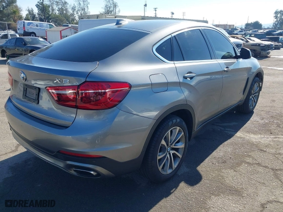2015 BMW X6 xDrive50i with VIN 5UXKU6C52F0F94060, listed as a IAAI auction lot 41299202 with 67,835 mi miles. Bid and sale history available at carsss.com. Image 4.