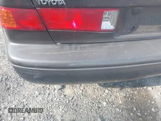 2000 Toyota Camry CE z VIN JT2BG28K3Y0513835, wystawiony jako IAAI lot #42309937 z przebiegiem 132 572 mil mil oraz . Historia ofert i sprzedaży dostępna na DreamBid. Obrazek 14.