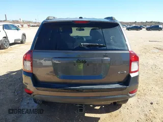 2014 Jeep Compass Sport with VIN 1C4NJCBA4ED880940, listed as a IAAI auction lot 41712357 with 156,171 mi miles. Bid and sale history available at carsss.com. Image 16.