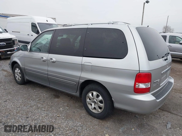 2004 Kia Sedona LX with VIN KNDUP131546535352, listed as a IAAI auction lot 41856784 with 128,943 mi miles. Bid and sale history available at carsss.com. Image 3.