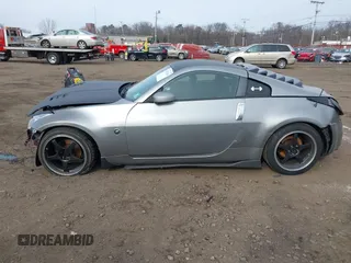 2003 Nissan 350Z Touring z VIN JN1AZ34E33T003711, wystawiony jako IAAI lot #41351191 z przebiegiem 167 503 mil mil oraz . Historia ofert i sprzedaży dostępna na DreamBid. Obrazek 14.