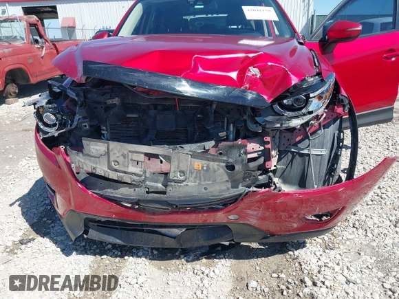 2016 Mazda CX-5 Grand Touring with VIN JM3KE2DYXG0652017, listed as a IAAI auction lot 42041158 with 95,946 mi miles and . Bid and sale history available at DreamBid. Image 6.
