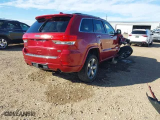 2014 Jeep Grand Cherokee Overland with VIN 1C4RJFCGXEC280970, listed as a IAAI auction lot 41504380 with 115,534 mi miles. Bid and sale history available at carsss.com. Image 4.