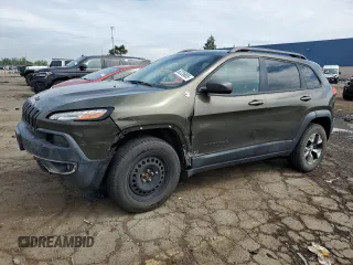 2015 Jeep Cherokee Trailhawk with VIN 1C4PJMBSXFW545534, listed as a Copart auction lot 62236885 with 148,448 mi miles and Clean title. Bid and sale history available at DreamBid. Image 1.
