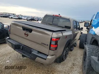 2024 Nissan Frontier SL with VIN 1N6ED1EJ4RN657334, listed as a Copart auction lot 55169675 with 5,706 mi miles and Salvage title. Bid and sale history available at DreamBid. Image 3.