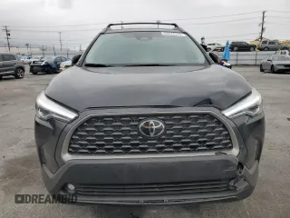 2024 Toyota Corolla Cross XLE with VIN 7MUDAAAG8RV095021, listed as a Copart auction lot 59232265 with 7,010 mi miles and Salvage title. Bid and sale history available at DreamBid. Image 5.