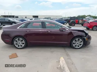 2013 Lincoln MKZ z VIN 3LN6L2GK2DR808761, wystawiony jako IAAI lot #42562086 z przebiegiem 124 087 mil mil oraz . Historia ofert i sprzedaży dostępna na DreamBid. Obrazek 14.