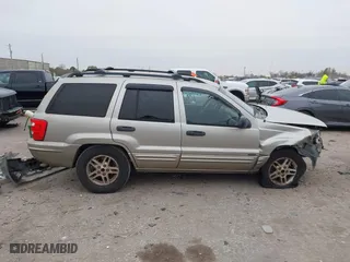 2004 Jeep Grand Cherokee Laredo with VIN 1J4GX48S44C301120, listed as a IAAI auction lot 41281556 with 267,246 mi miles. Bid and sale history available at carsss.com. Image 14.