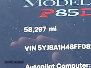 2015 Tesla Model S 85D with VIN 5YJSA1H48FF082038, listed as a IAAI auction lot 41712242 with 58,297 mi miles. Bid and sale history available at carsss.com. Image 15.