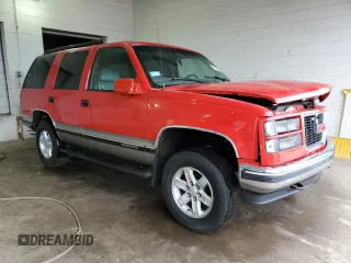 1999 GMC Yukon with VIN 1GKEK13R1XJ711537, listed as a Copart auction lot 51658175 with 228,786 mi miles and Salvage Title. Bid and sale history available at carsss.com. Image 4.