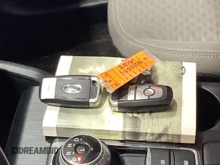 2021 Ford Escape SE Hybrid with VIN 1FMCU0BZ2MUA14148, listed as a IAAI auction lot 42749961 with 99,509 mi miles and . Bid and sale history available at DreamBid. Image 1.