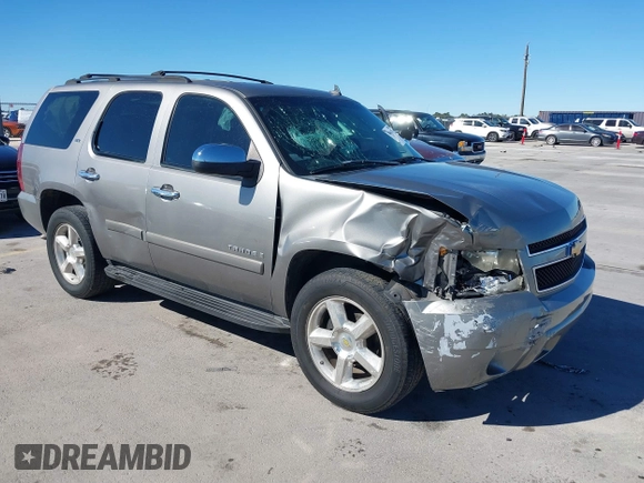 2007 Chevrolet Tahoe LTZ with VIN 1GNFC13J97R155705, listed as a IAAI auction lot 40914171 with 165,727 mi miles and . Bid and sale history available at DreamBid. Image 1.