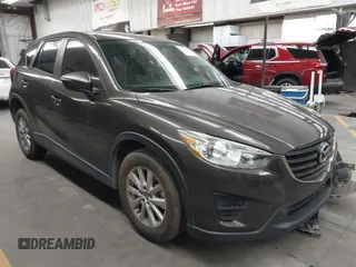 2016 Mazda CX-5 Sport with VIN JM3KE2BY9G0761832, listed as a IAAI auction lot 42433200 with 169,799 mi miles and . Bid and sale history available at DreamBid. Image 1.