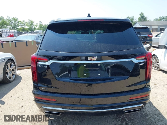 2021 Cadillac XT6 Premium Luxury with VIN 1GYKPDRS0MZ153523, listed as a IAAI auction lot 42770895 with 19,843 mi miles and . Bid and sale history available at DreamBid. Image 16.