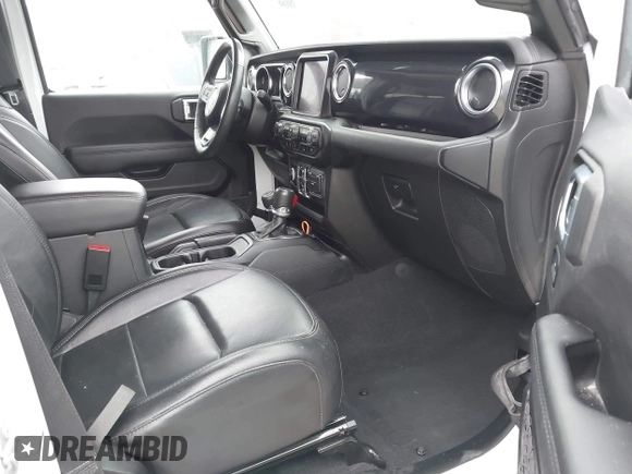 2023 Jeep Wrangler Sahara with VIN 1C4HJXEG5PW581632, listed as a IAAI auction lot 42462622 with 24,550 mi miles and . Bid and sale history available at DreamBid. Image 5.
