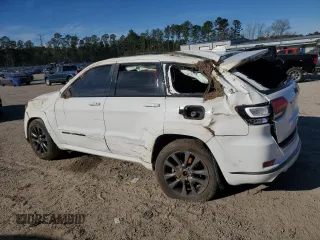 2018 Jeep Grand Cherokee High Altitude with VIN 1C4RJECG1JC125602, listed as a Copart auction lot 88702275 with 59,701 mi miles and Salvage title. Bid and sale history available at DreamBid. Image 2.