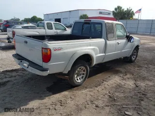 2002 Mazda B-Series 2WD Truck DS with VIN 4F4YR16V12TM23907, listed as a IAAI auction lot 42088643 with 247,760 mi miles. Bid and sale history available at carsss.com. Image 4.