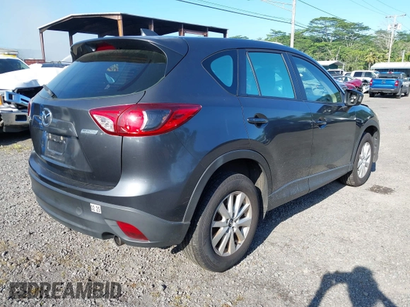 2014 Mazda CX-5 Sport with VIN JM3KE2BE8E0313407, listed as a IAAI auction lot 41215428 with 120,387 mi miles and . Bid and sale history available at carsss.com. Image 4.