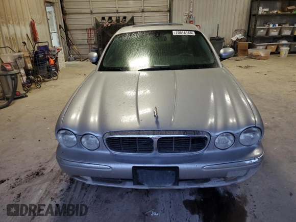 2004 Jaguar XJ with VIN SAJEA71C84SG07220, listed as a Copart auction lot 70916164 with 151,102 mi miles and Salvage Title. Bid and sale history available at carsss.com. Image 5.