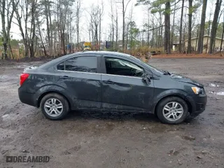 2014 Chevrolet Sonic LT with VIN 1G1JC5SH8E4234634, listed as a IAAI auction lot 41464054 with 117,113 mi miles. Bid and sale history available at carsss.com. Image 14.