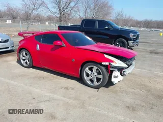 2012 Nissan 370Z z VIN JN1AZ4EHXCM563993, wystawiony jako IAAI lot #41802034 z przebiegiem 77 935 mil mil oraz . Historia ofert i sprzedaży dostępna na DreamBid. Obrazek 1.