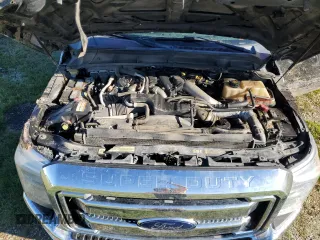 2014 Ford F-350 XLT with VIN 1FT8W3BT2EEA54050, listed as a Copart auction lot 50062505 with 142,252 mi miles and Salvage title. Bid and sale history available at DreamBid. Image 11.