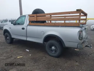 1999 Ford F-150 with VIN 2FTZF1828XCA85643, listed as a IAAI auction lot 41347113 with 173,813 mi miles and . Bid and sale history available at DreamBid. Image 3.