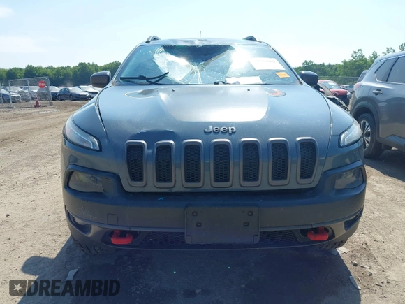 2014 Jeep Cherokee Trailhawk z VIN 1C4PJMBSXEW273520, wystawiony jako IAAI lot #42569063 z przebiegiem 137 585 mil mil oraz . Historia ofert i sprzedaży dostępna na DreamBid. Obrazek 12.