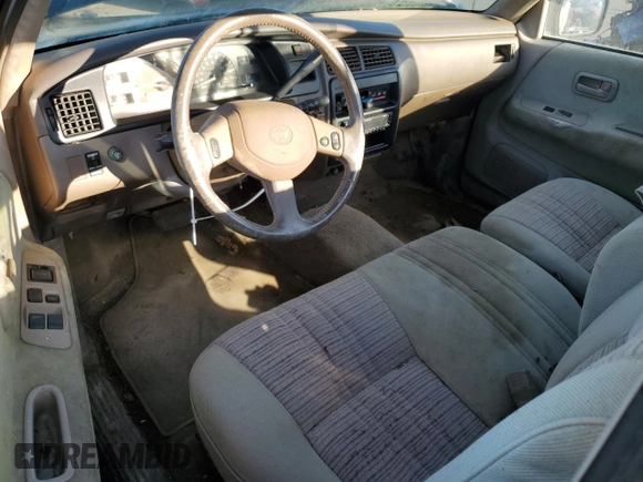 1993 Toyota T100 z VIN JT4VD10C2P0007486, wystawiony jako Copart lot #77669724 z przebiegiem 150 936 mil mil oraz Tytuł czysty. Historia ofert i sprzedaży dostępna na DreamBid. Obrazek 8.