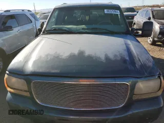 2000 GMC Denali z VIN 1GKEK13R5YR162198, wystawiony jako Copart lot #80325964 z przebiegiem 228 043 mil mil oraz Szkody całkowita. Historia ofert i sprzedaży dostępna na DreamBid. Obrazek 11.