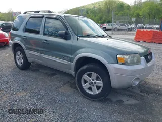 2007 Ford Escape Hybrid with VIN 1FMCU59HX7KB25010, listed as a IAAI auction lot 42159589 with 217,254 mi miles and . Bid and sale history available at DreamBid. Image 1.