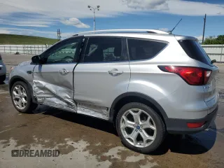 2019 Ford Escape Titanium с VIN 1FMCU9J90KUB85595, выставлен на аукционе Copart как лот 57410045 с пробегом 47 995 миль миль и Списание • Salvage title. История ставок и продаж доступна на DreamBid. Изображение 2.