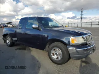 2000 Ford F-150 with VIN 1FTRX07W3YKA56561, listed as a Copart auction lot 81149654 with 185,967 mi miles and Salvage title. Bid and sale history available at DreamBid. Image 4.