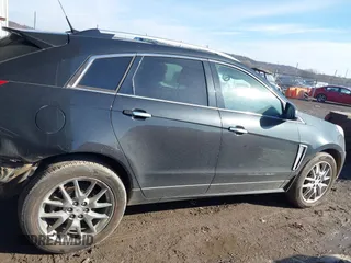 2014 Cadillac SRX Premium Collection z VIN 3GYFNDE34ES581728, wystawiony jako IAAI lot #41578226 z przebiegiem 121 118 mil mil oraz . Historia ofert i sprzedaży dostępna na DreamBid. Obrazek 14.