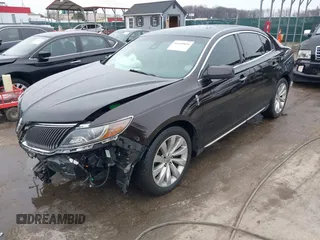 2014 Lincoln MKS with VIN 1LNHL9EK7EG609329, listed as a IAAI auction lot 41555819 with 89,849 mi miles. Bid and sale history available at carsss.com. Image 17.