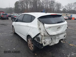 2014 Hyundai Accent SE with VIN KMHCU5AE8EU145629, listed as a IAAI auction lot 41497848 with 134,919 mi miles. Bid and sale history available at carsss.com. Image 3.