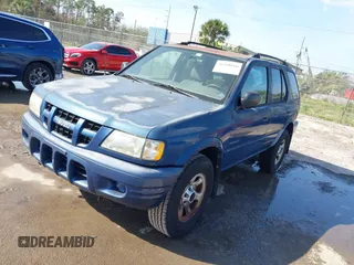 2004 Isuzu Rodeo S with VIN 4S2CK58W944317209, listed as a IAAI auction lot 41498160 with 114,764 mi miles and . Bid and sale history available at DreamBid. Image 2.