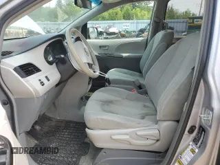 2014 Toyota Sienna L with VIN 5TDZK3DC8ES442973, listed as a Copart auction lot 59660055 with 310,496 mi miles and Salvage title. Bid and sale history available at DreamBid. Image 7.