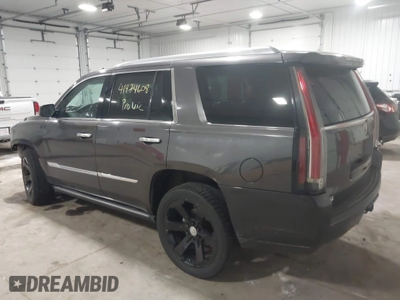 2015 Cadillac Escalade Premium with VIN 1GYS4CKJ8FR308617, listed as a IAAI auction lot 41974608 with 154,014 mi miles and . Bid and sale history available at DreamBid. Image 3.